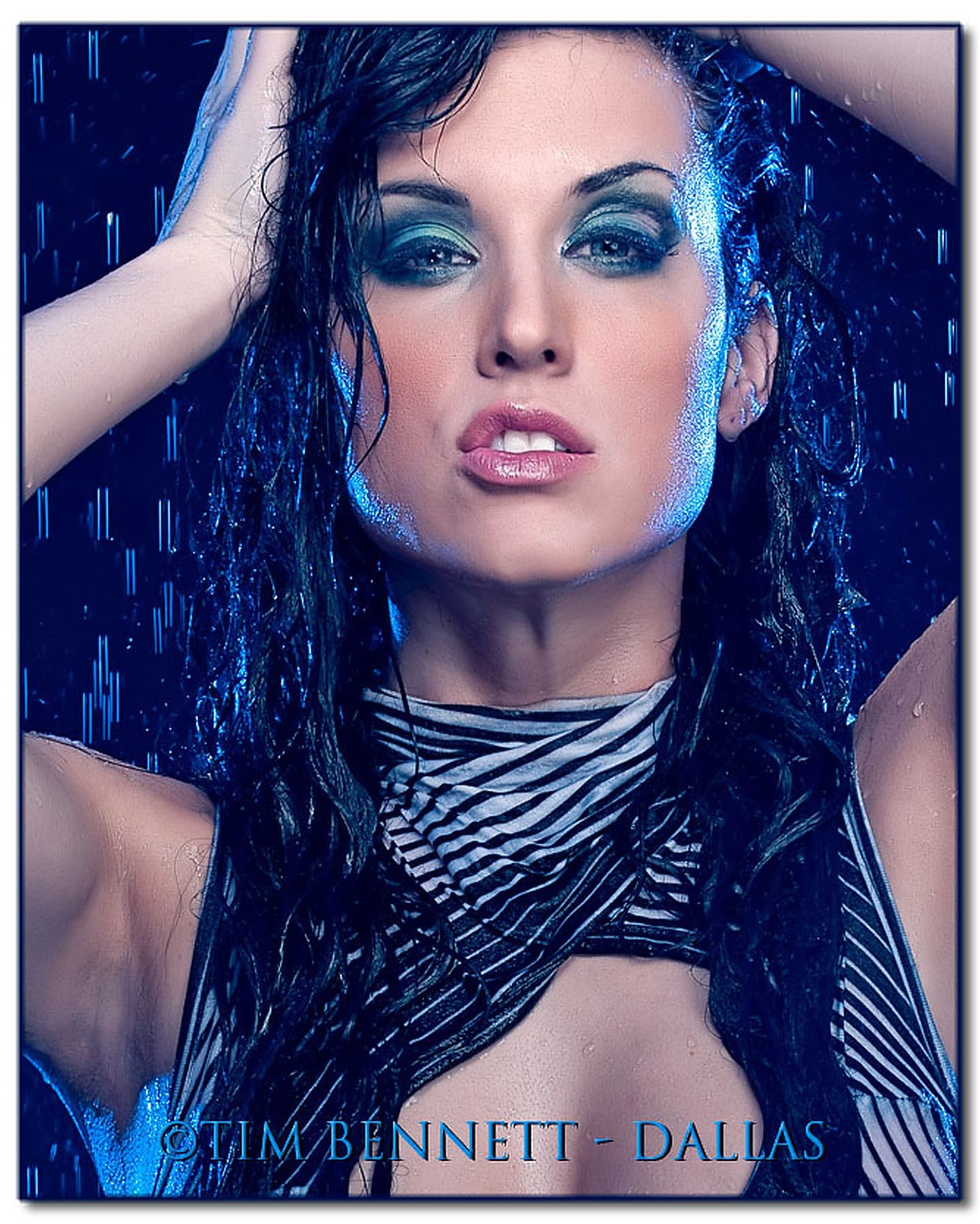 Alyson in a dramatic blue rain beauty portrait photographed by Tim Bennett