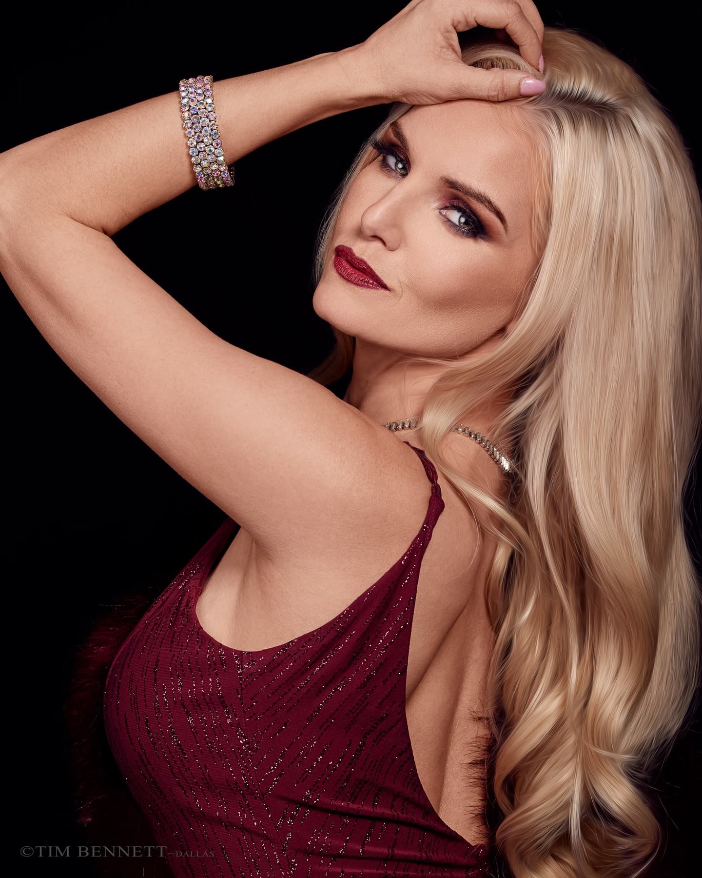 Liz Ashley in a burgundy gown photographed by Tim Bennett